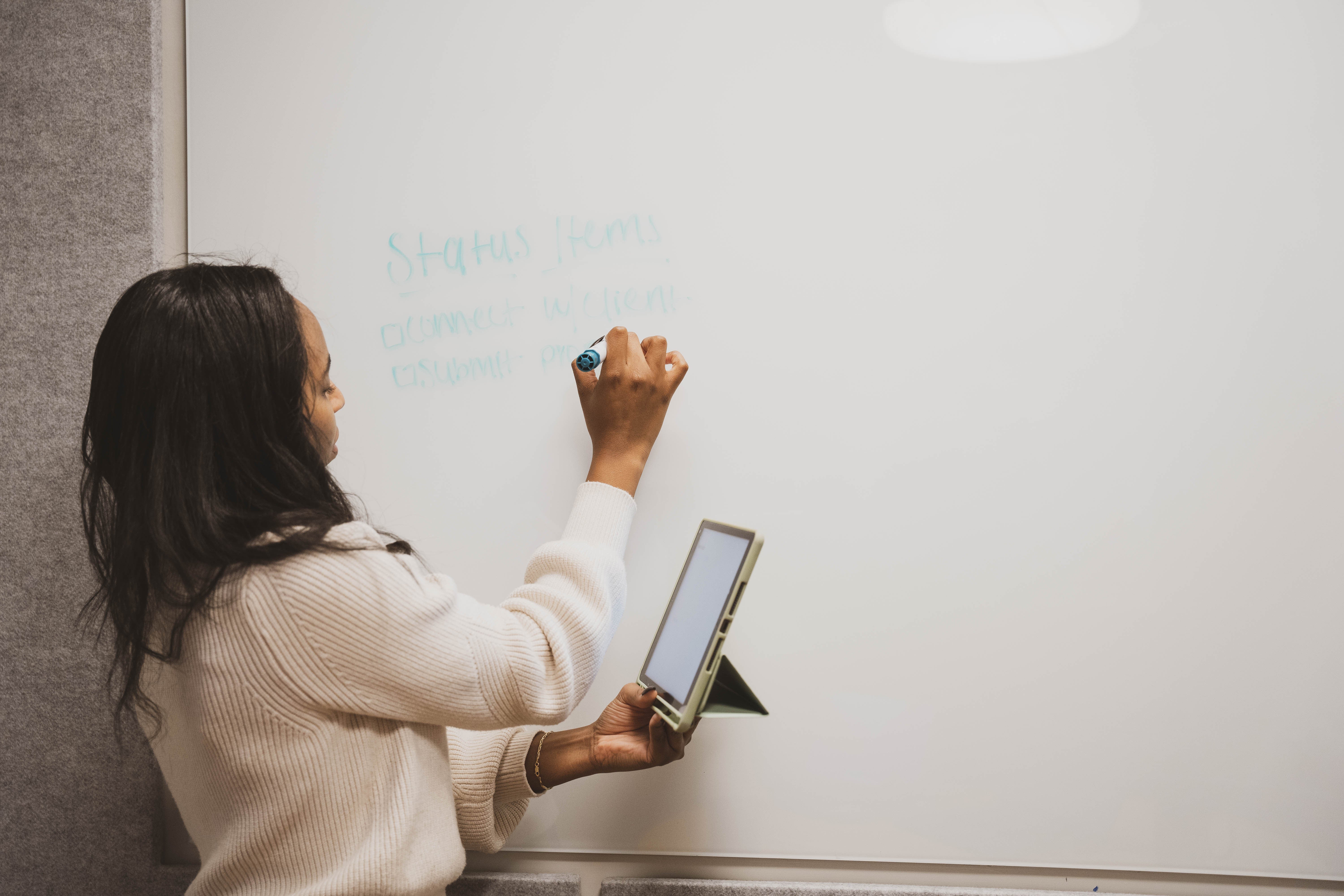 A founder mapping priorities on a whiteboard.